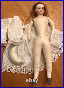 Rare Parisian poupee peau by luxury doll maker Louis Doleac